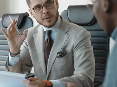 Businessman gesturing while speaking in a meeting